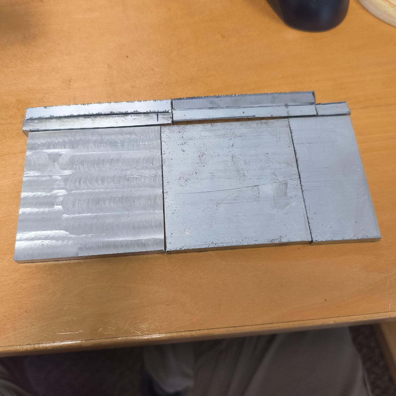 The lantern plates on a bench, cut and faced.