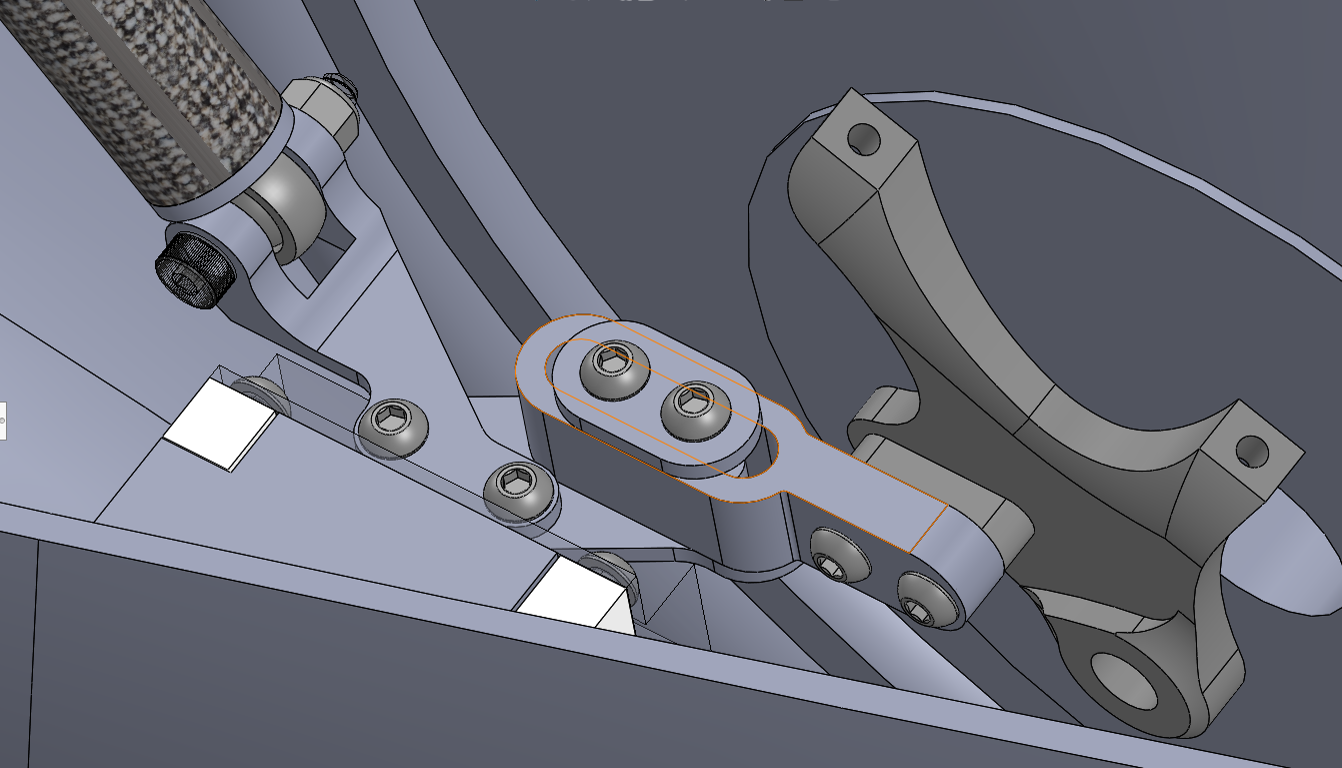 CAD of the redesigned adapter in place, its adjustment screws facing upward where a hex key can reach them.